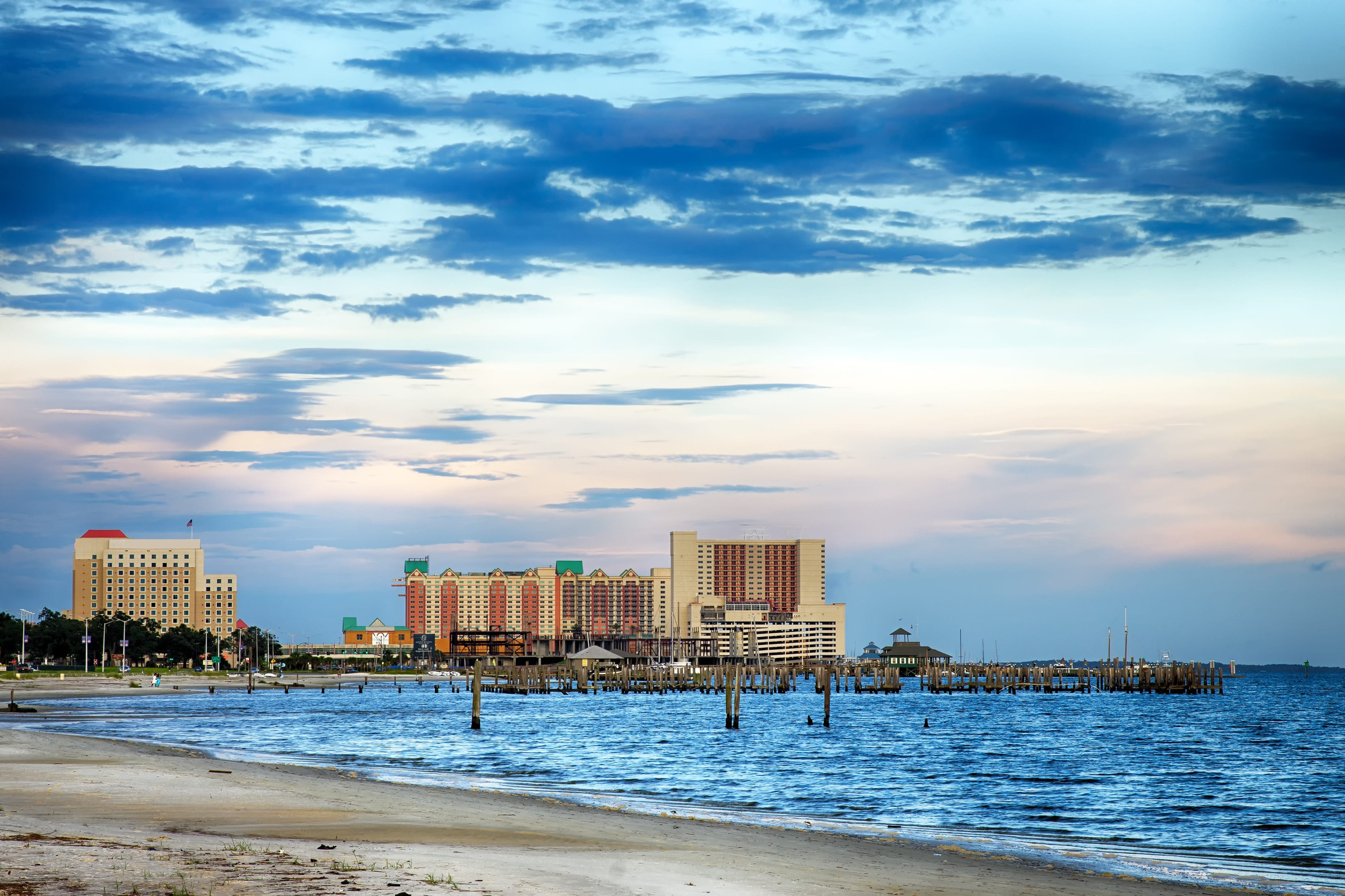 view of ocean, beach, and hotel