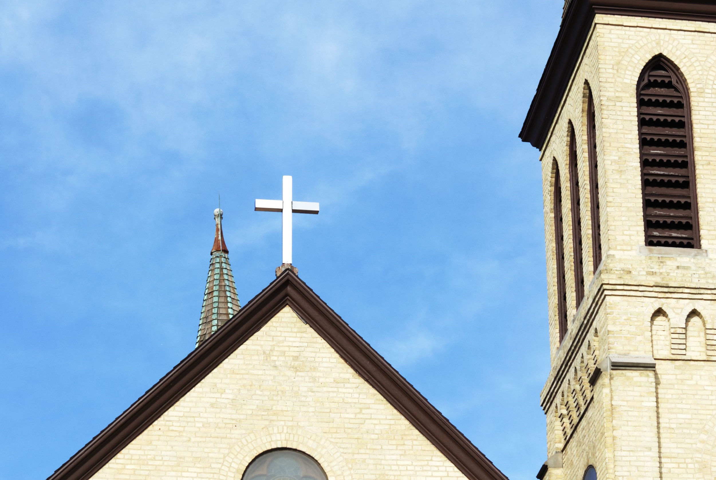 cross on roof of church building
