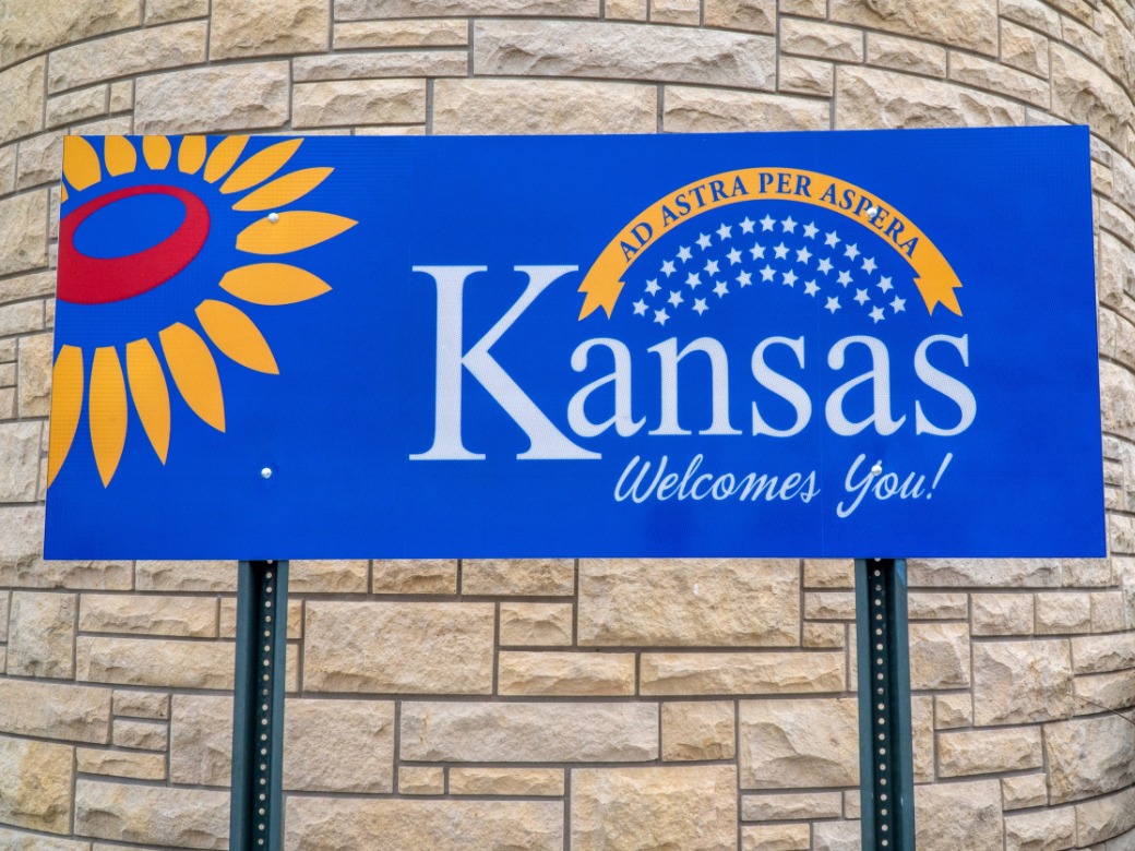 Welcome to Kansas road sign