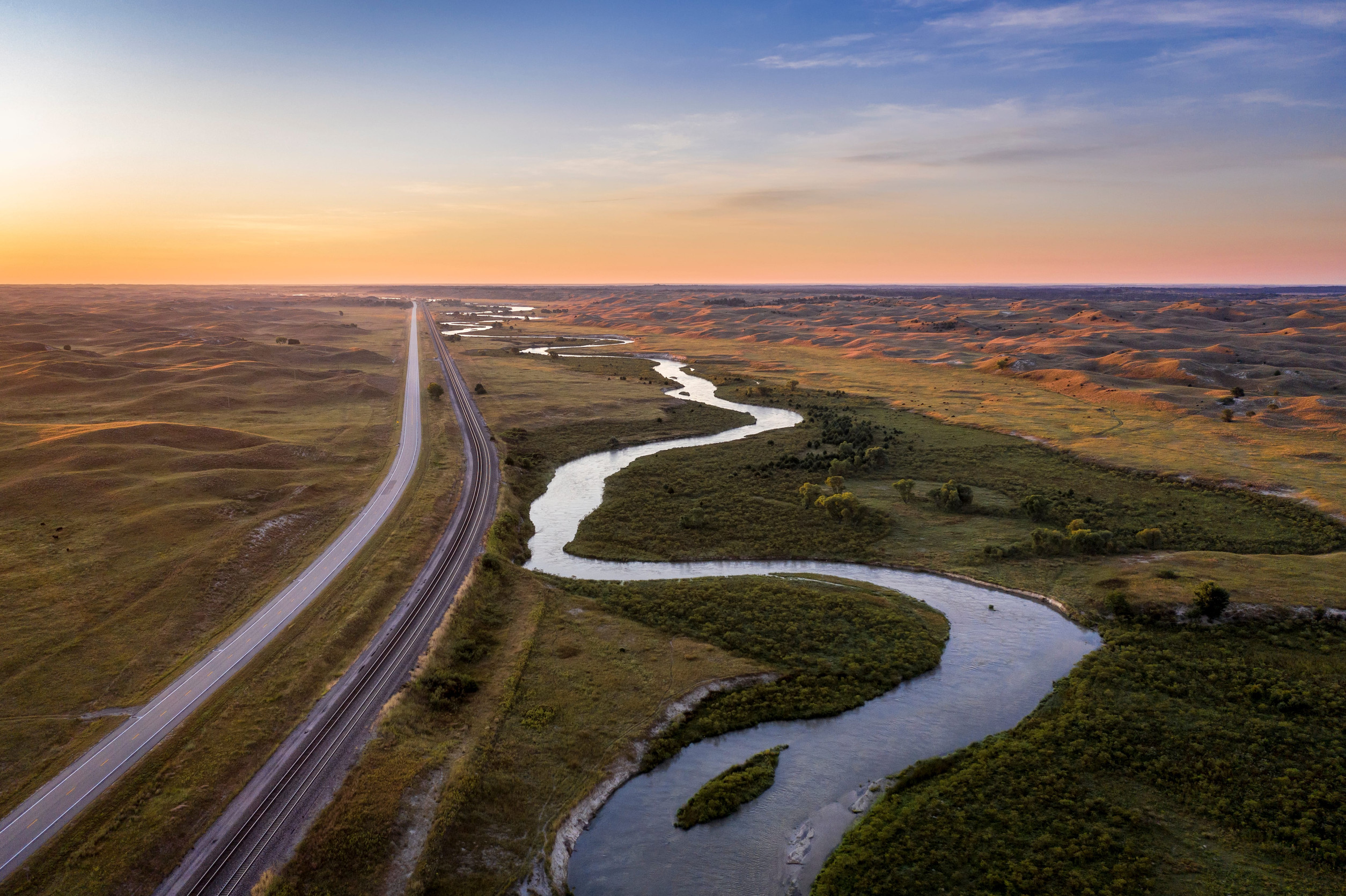 landscape with railroad tracks and river